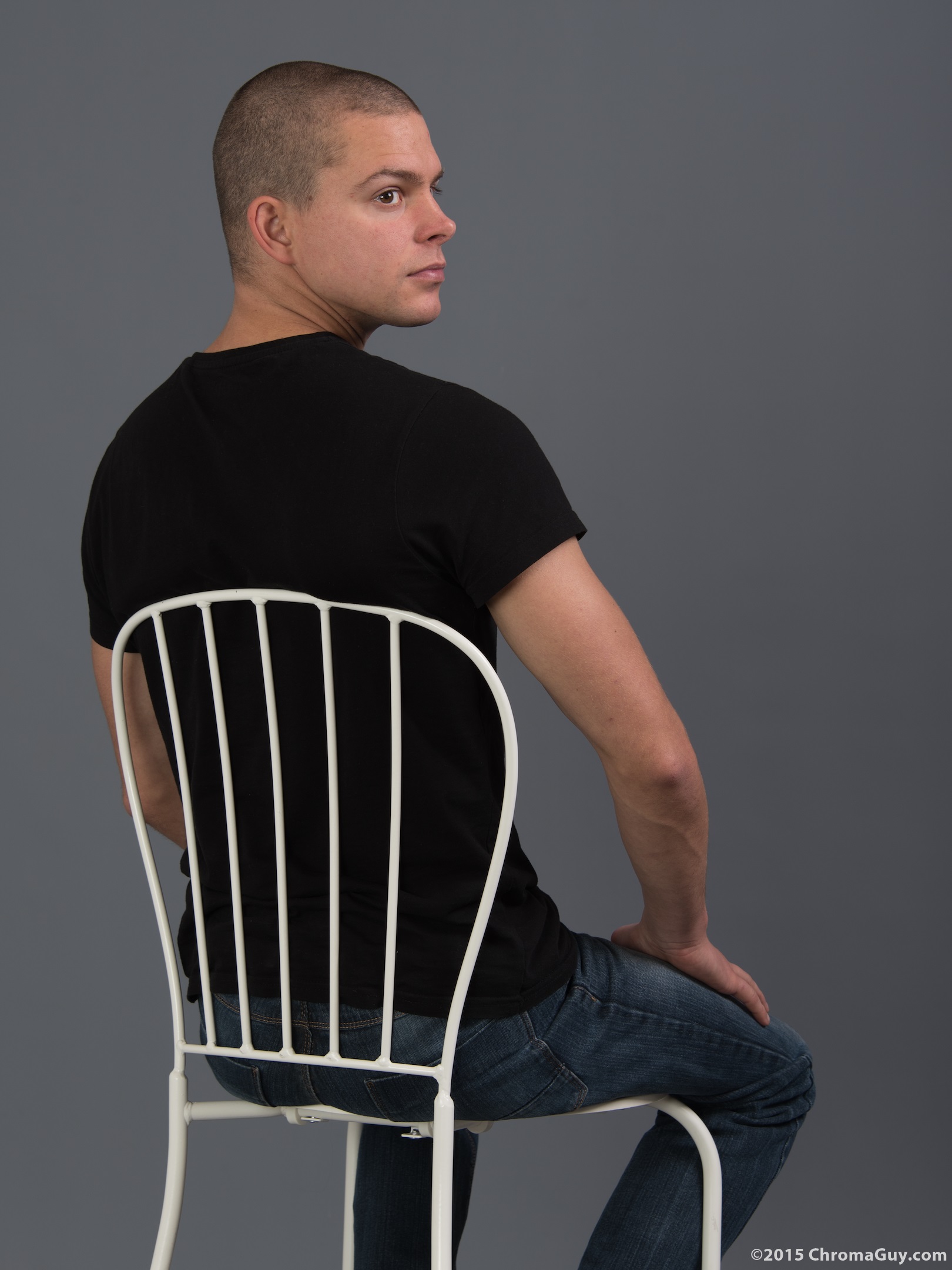 Rear view of guy sitting on chair