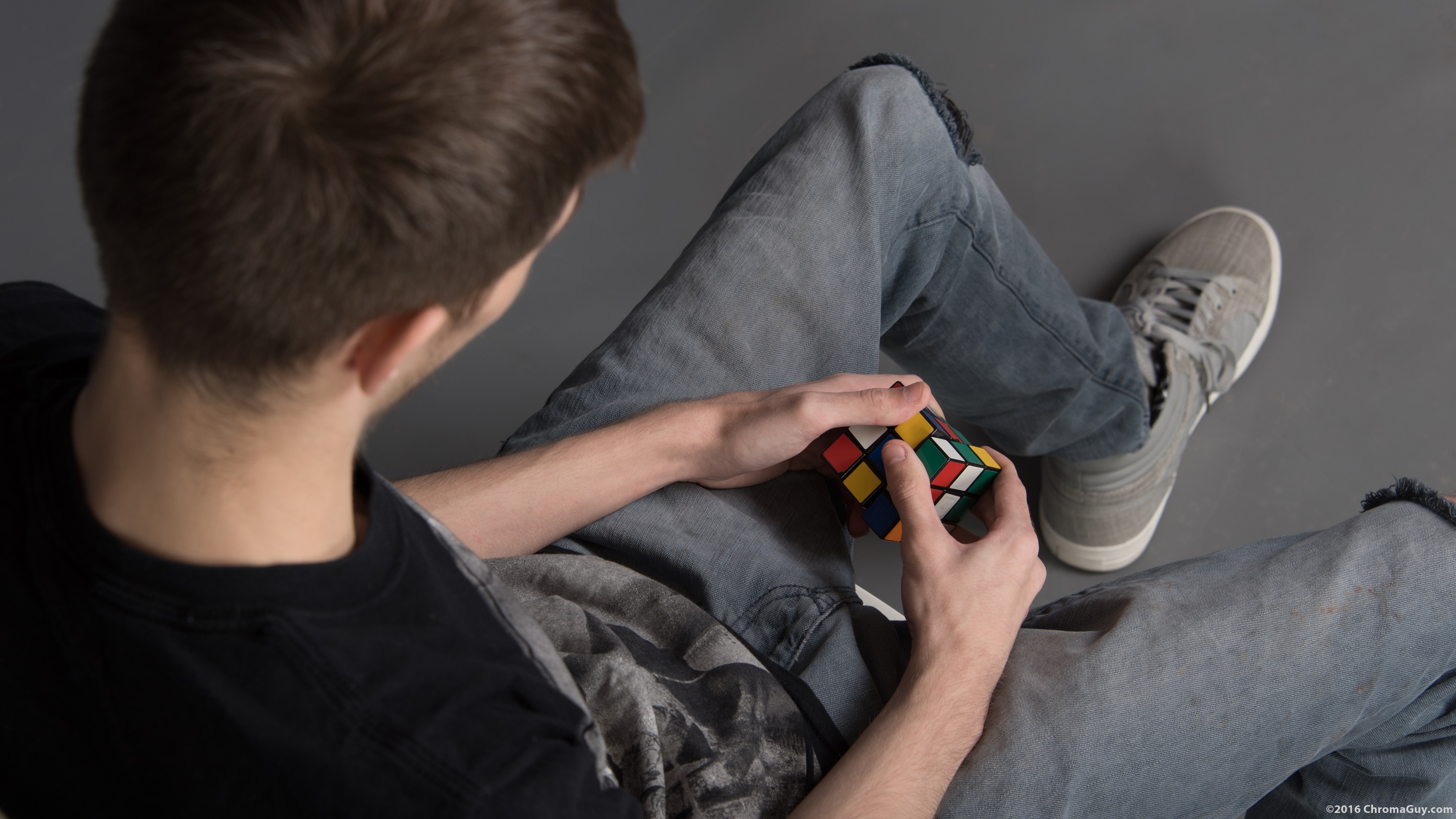 Boy playing with rubik's cube