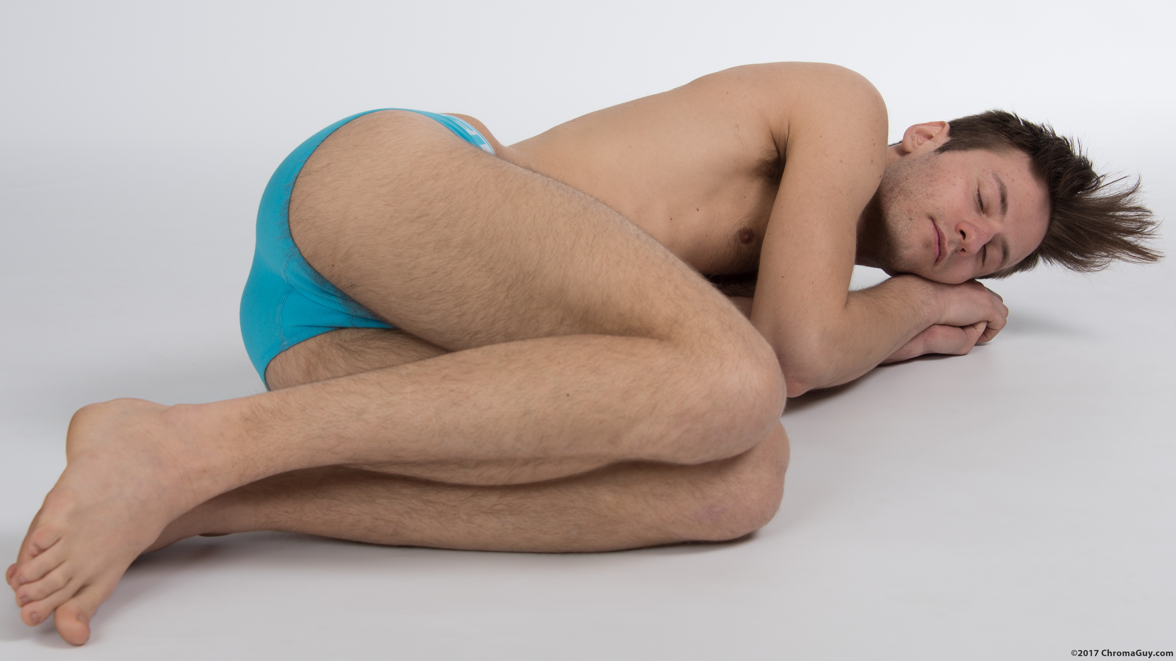 Guy lying sideways in underwear